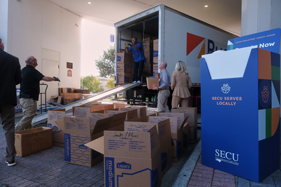 SECU donated perishable goods being loaded into a box truck